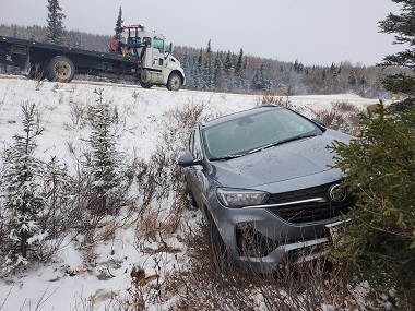 Buick Encore GX over the bank being recovered by JC's Towing and Recovery LLC